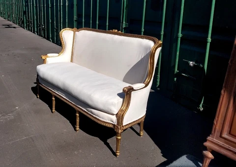 Gorgeous French Louis XVI Gilded Wingback Sofa with Decorative Serpentine motif Cover