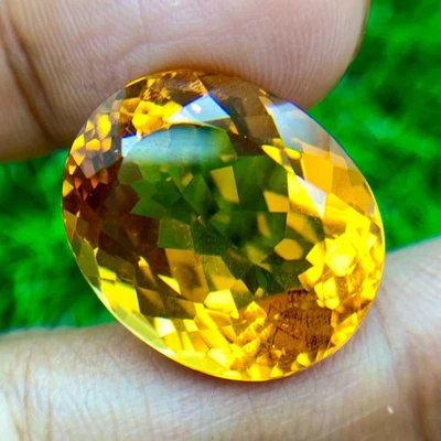 MESMERIZE 29.24 CT GOLDEN YELLOW CITRINE OVAL LAB CREATED LOOSE GEMSTONE - Image 1 of 3