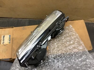 GM# 16516755 1989-91 PONTIAC GRAND AM NOS LH HEADLIGHT CAPSULE DISCONTINUED FRO - Picture 1 of 5