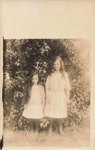 RPPC Two Sisters in Yard Pretty Girls Freaky Long Hair Dresses c1920 Antique 562 - Picture 1 of 2