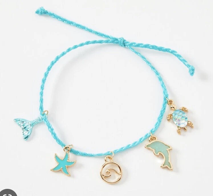 Pulsera Bolo Claire’s Blue Dolphin Beach Surf Turtle Mermaid Foto 1 de 1