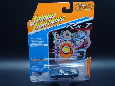 2025 JOHNNY LIGHTNING 1985 MAZDA RX-7 REL DE OURO CLÁSSICO AZUL 2 VS B NO 2 1:64 - Imagem 1 de 4