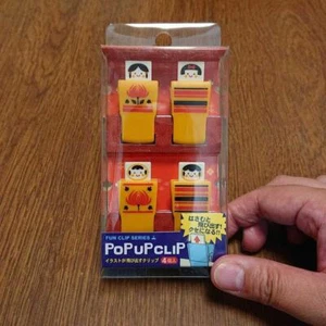 Ein etwas ungewöhnlicher Clip mit einer Kokeshi Puppe Illustration knallt heraus Pop Up Clip - Bild 1 von 4