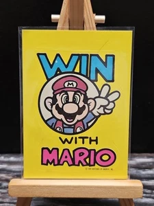 1989 Topps Nintendo Game Tip Stickers #18 Win With Mario (Pencil Mark) - Picture 1 of 2
