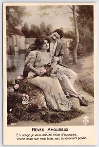 RPPC Romantic Couple Hand Tinted Studio Postcard LYS 2027 Sitting Rocks Flowers - Picture 1 of 2