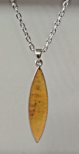 "PR7"--silver tone & iridescent pearly yellow mop inset pendant necklace
