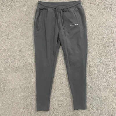 Pantalones deportivos elásticos Alphalete para hombre gris liso medio Foto 1 de 4