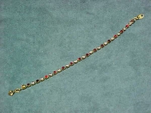 Avon Gold Tone Tennis Bracelet July Birthstone Ruby Color & Clear Crystal 7 inch - Picture 1 of 5