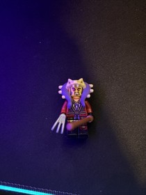 The minifigure is LEGO Ninjago Master Chen (njo126).