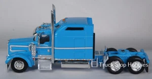 HO 1:87 TSH # 631 Kenworth 900L Tandem Axle Tractor - Light Blue/White Ray Carls - Picture 1 of 2