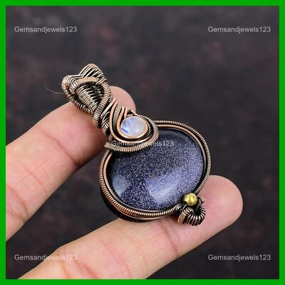 Colgante de cobre ovalado natural azul piedra solar arco iris piedra lunar alambre envuelto joyería Foto 1 de 4