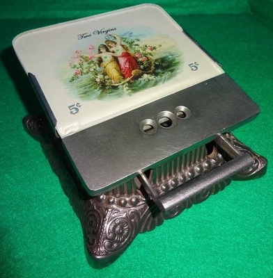 Cortador de tienda de cigarros de hierro fundido Erie Company dos vírgenes mujeres desnudas pechos desnudos Foto 1 de 4