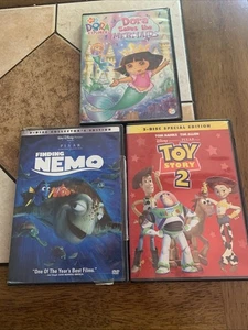 Toy Story 2 , Finding Nemo , Dora Saves The Mermaids. 3️⃣ DVD - Picture 1 of 8