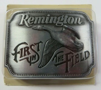 Fivela de cinto vintage 1980 REMINGTON Arms Canada Goose PRIMEIRO NO CAMPO estanho nova na embalagem - Imagem 1 de 4