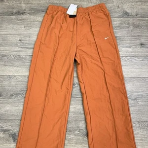 Pantalones Nike con dobladillo abierto talla XL naranja ropa deportiva todo tejido tiro medio - Imagen 1 de 13
