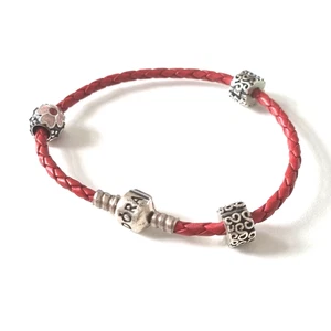 Armband von " PANDORA " - Band aus Leder - drei  925 Silber Charms - Bild 1 von 5