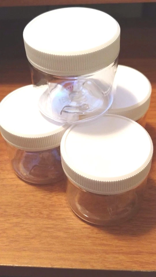 Set of 4, 2 oz Clear PET Plastic Jars With White Plastic Twist Cap - Image 1 of 1