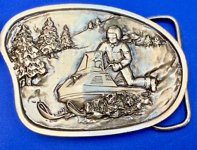 Snowmobile Winter Sports Snowy Mountain Scene Vintage 1977 Bergamot Belt Buckle - Image 1 of 4