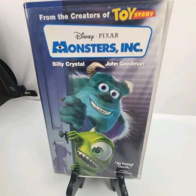 Monsters, Inc. (VHS, 2002) Disney Pixar Clear Clam Shell Case & Blue Tape Foto 1 de 4
