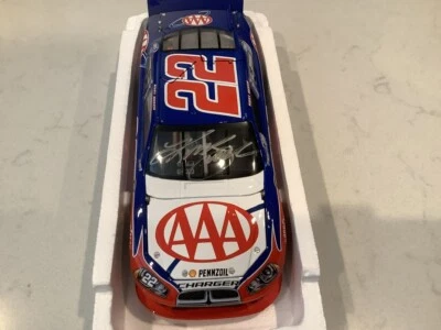 KURT BUSCH AUTOGRAPHED 2011 DODGE CHARGER AAA DIECAST & AUTOGRAPHED CARD - Image 1 of 4