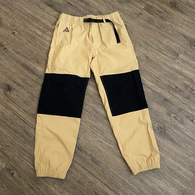 Pantalones de cola Nike ACG marrón dorado cordón cintura elástica CD4540-723 para hombre pequeños S Foto 1 de 4
