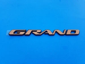 99 00 01 02 03 04 05 PONTIAC GRAND AM SIDE DOOR EMBLEM BADGE NOS NEW OEM (2003) - Picture 1 of 3