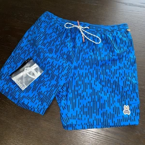 NEU OHNE ETIKETT PSYCHO BUNNY HERREN BLAU GESTREIFT BADEHOSE/SHORTS 437 NEON POOL Größe L - Bild 1 von 4