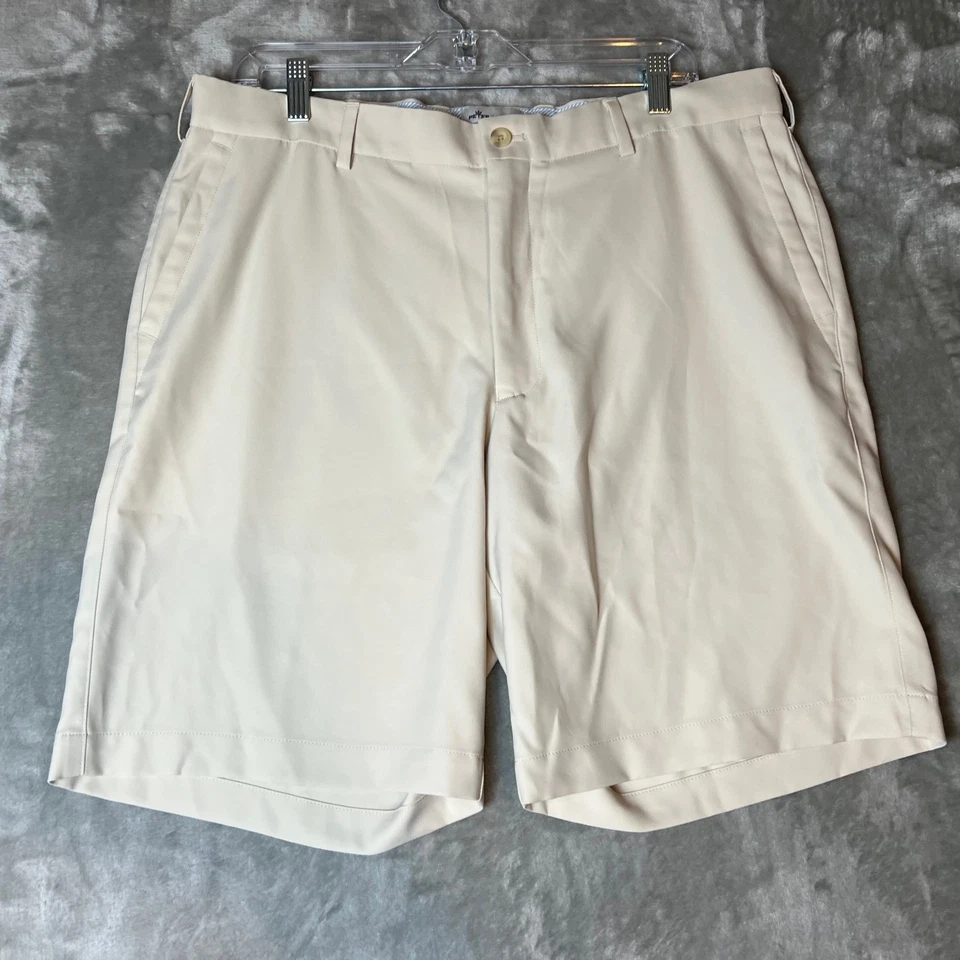 Pantalones cortos de golf Peter Millar caqui para hombre talla 36 frente plano ligeros Foto 1 de 4