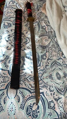 espada, mango negro y rojo Foto 1 de 2