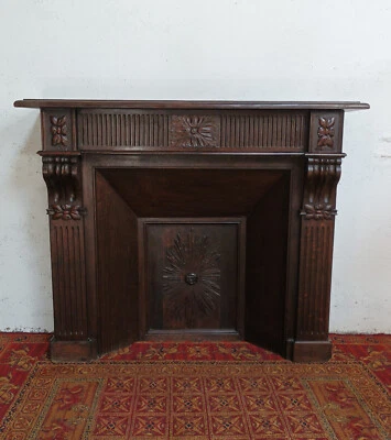 Cheminée Napoléon III en chêne massif sculpté - Photo 1/4