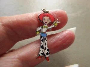 PRE LOVED VINTAGE JESSIE TOY STORY GOLD TONE ENAMEL DISNEY PIXAR CHARM PENDANT - Picture 1 of 3