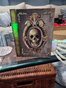 Animated SKULL SKELETON HAND PILE OF BOOKS PROP EVIL DEAD LAUGHTER LIGHTS UP - Picture 1 of 12