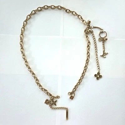 Auténtico cinturón de cadena Louis Vuitton de colección correa dorada inclusión dijes extraíbles Foto 1 de 4