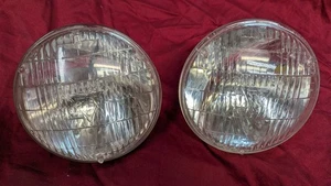 2 OEM 1960-1967 GM T-3 Headlight Bulbs Headlamps IMPALA SS CHEVELLE BUICK OLDS - Foto 1 di 8