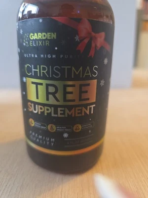 Suplemento de árbol de Navidad Garden Elixir - Fórmula premium de 8 fl oz para fresco,... Foto 1 de 4