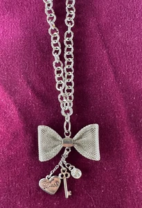 Signed Guess Necklace silvertone pendant: Mesh Bow heart, key & crystal dangle  - Picture 1 of 12