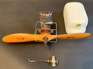 Collectible McCoy .29 Red Head model engine with gas tank - is in good condition