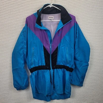 Vintage Reebok Sport Women’s Color Block Windbreaker Size Med EUC Blue Purple  Foto 1 de 4