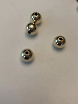 Cuentas redondas sin costuras rellenas de oro de 14kt de 7 mm 6 piezas. Foto 1 de 4