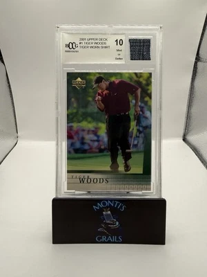 2001 Upper Deck - Tiger Woods #1 (RC, MEM) BCCG 10 With Tiger Worn Shirt Patch - Image 1 of 4