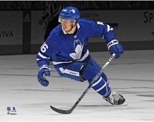 Mitch Marner Toronto Maple Leafs Unsigned Blue Jersey Skating Spotlight Photo