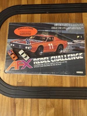 AFXREBELCHALLENGESET(COMPLETE)1 “REBEL” CHARGERCAR,1LIGHTED STOCKERCAR+1bonusCar - Image 1 of 4
