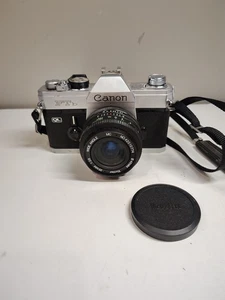 Canon FTb QL 35 mm fotocamera reflex pellicola obiettivo vivatar 2,8-16 mm - Foto 1 di 8