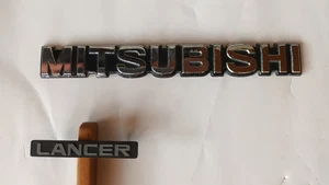  Mitsubishi Emblem MB 117150-2, 1 Stück und 1 Stück Lancer MA 145346 Schriftzug - Bild 1 von 6