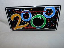 WALT DISNEY WORLD 2000 CELEBRATE THE FUTURE HAND IN HAND METAL LICENSE PLATE