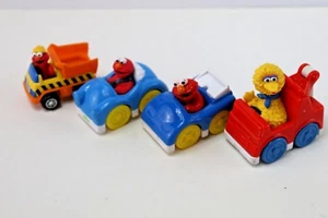 Sesamstraße 4 Stück Mattel Tyco Spielzeug Fahrzeuge Figuren Elmo Big Bird - Bild 1 von 2