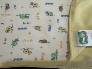 Manta Bebé Pampers Algodón Amarillo Estampado Animal Hello Bonjour Tortuga Caracol DEFECTOS - Imagen 1 de 8