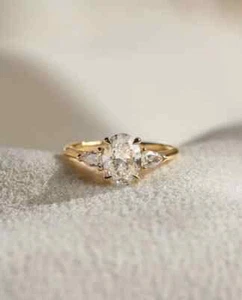 3.00 Ct Oval-Cut Moissanite Three Stone Engagement Ring 14k Yellow Gold Plated - Picture 1 of 3