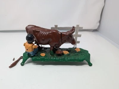 Vintage BOOK OF KNOWLEDGE Milking Cow Cast Iron Mechanical Bank Bull Painted - Image 1 of 4