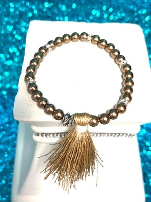 Pulsera elástica de bronce con borla de cristal hecha en Texas 7 pulgadas vendedor de EE. UU. Foto 1 de 4